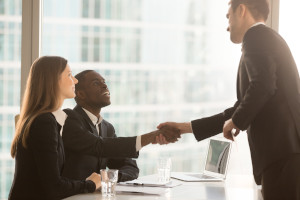 Job candidate shaking hands with their recruiter