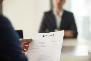 An employer reviewing a resume