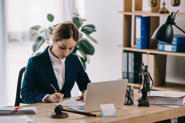 Paralegal employee reviewing document